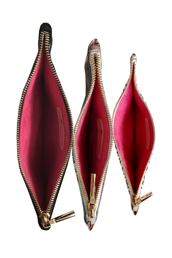 shown from above the interior of the pouches in raspberry suede with a zipper