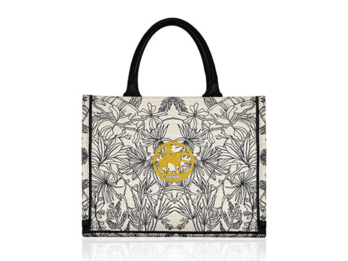 Black and white printed on cotton tote bag with black leather handles. Gold logotype embroidered in the center