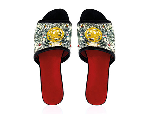 black and white canvas slip on sandals with gold stitching and colored hand embroidered beads. Red leather interior and black leather toes