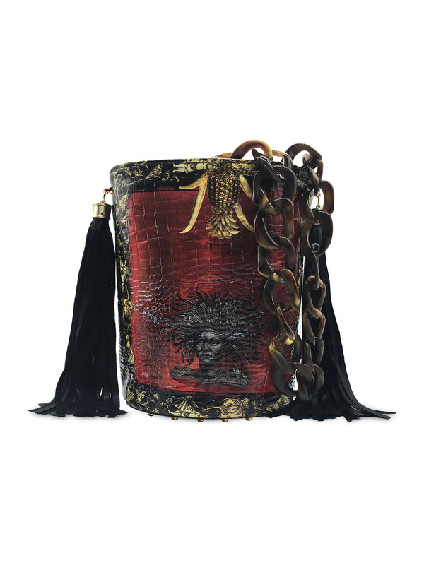 Red, black and gold printed glossy croc effect genuine leather bucket bag. 2 leather side tassels and resin linked chain handle