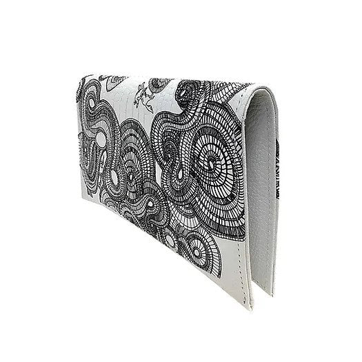 Handcrafted black and white clutch bag with printing on embossed, genuine glossy leather, of the black spirals design